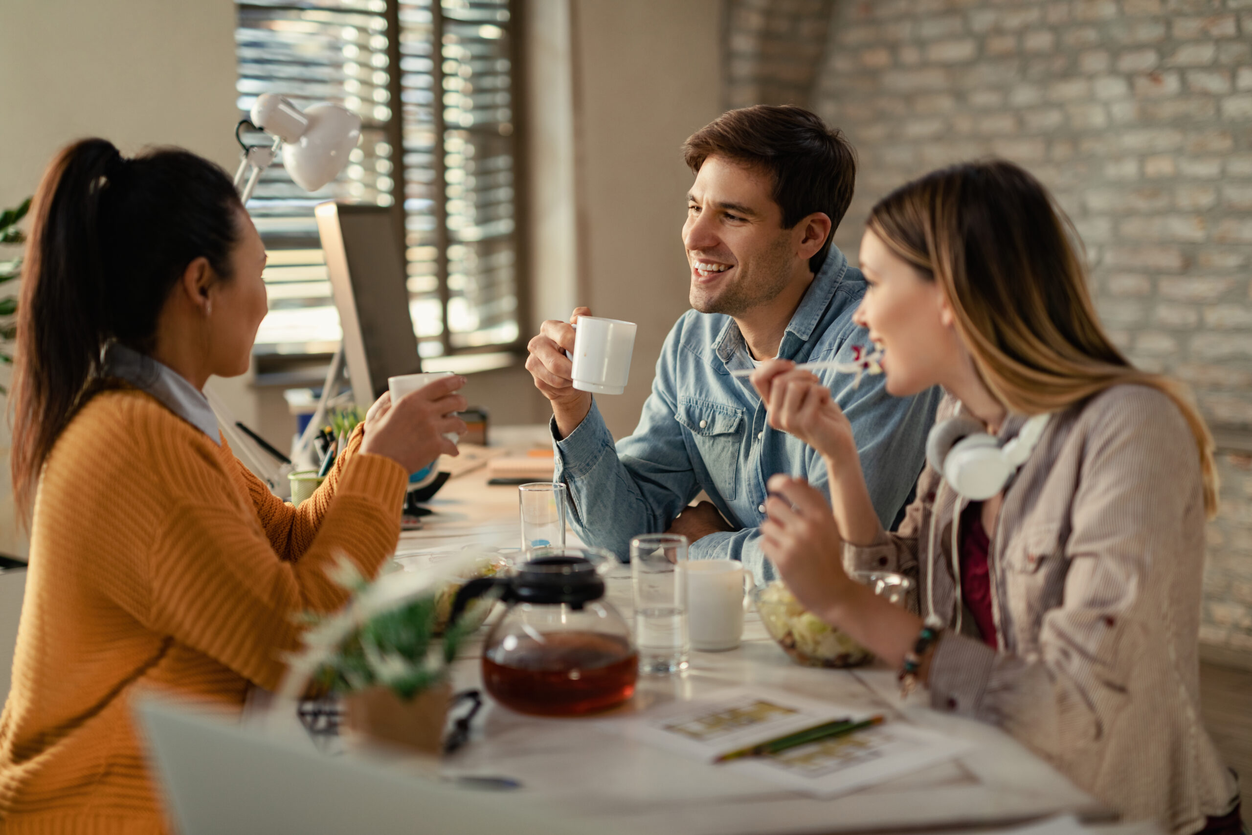 Group,Of,Happy,Business,Colleagues,Talking,During,Lunch,Break,In